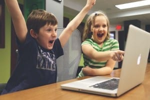 Kids Cheering at the laptop
